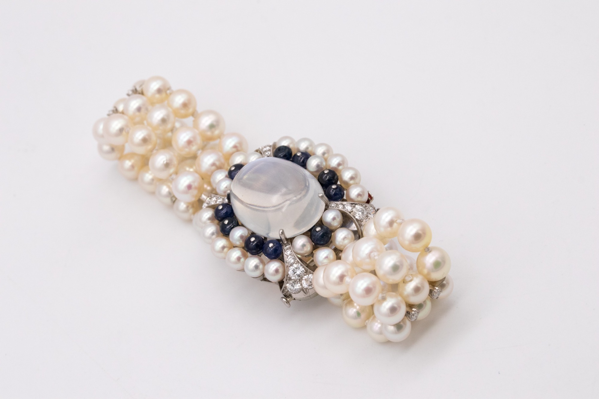 RAYMOND YARD ART DECO MOONSTONE, SAPPHIRE, DIAMOND AND PEARL BRACELET, CIRCA 1940