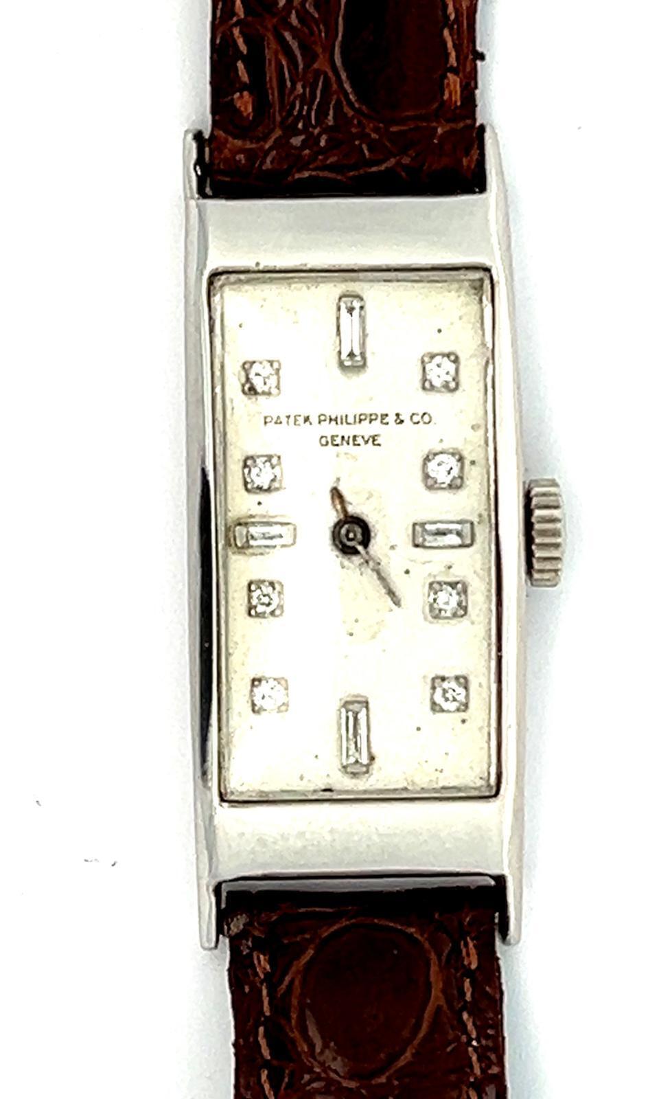 PATEK PHILIPPE PLATINUM ART DECO LONG RECTANGULAR WRISTWATCH WITH DIAMOND MARKER DIAL, CIRCA 1927